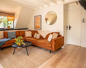 Cozy living room in Holiday Home in Lanaken, Limburg, with comfortable sofa and stylish furnishings for a relaxing stay.