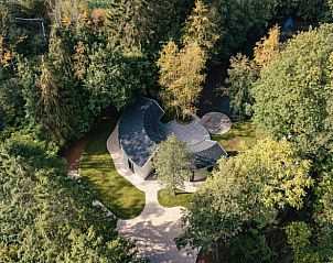 Aerial view of Holiday home in Hechtel Eksel, located in the lush nature of Limburg, Belgium, surrounded by greenery and tranquility.