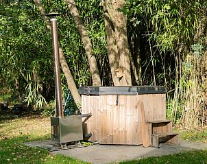 Enjoy peace and quiet at the Holiday Home in Hechtel Eksel, Limburg, with a private hot tub surrounded by nature.