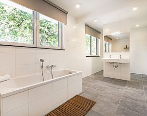 Cozy living room in Mooi Zutendaal 6-person wellness villa, located in green Limburg, Belgium, overlooking nature.