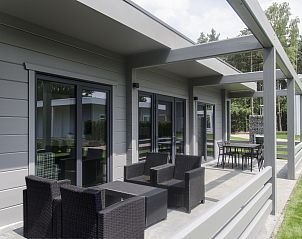 Veranda of Mooi Zutendaal 4-person villa 4CE1 in Zutendaal, Limburg, Belgium, with comfortable seating and views of nature.