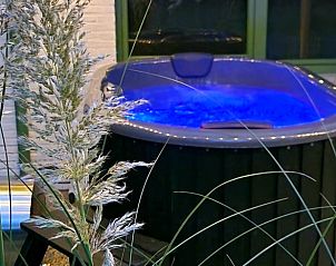 Relaxing Jacuzzi at Cottage in Lanaken, a vacation home in Gellik, Limburg, Belgium, surrounded by nature and tranquility.