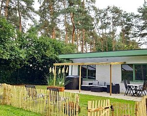 Enjoy the tranquility at Cottage in Lanaken, a vacation home in Gellik, Limburg, Belgium, with an inviting terrace and green surroundings.