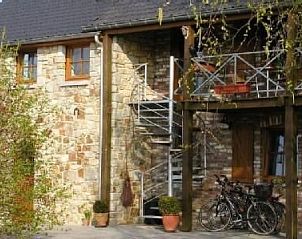 Charming Apartment Vue au Jardin with stone facade and terrace in Hombourg, Ardennes, Belgium, ideal for nature lovers.