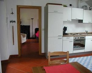 Cozy kitchen of Apartment Vue au Jardin in Hombourg, Ardennes, Belgium, with modern facilities and access to the cozy living room.