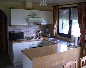 Modern kitchen in vacation home Zur Krombisch, Elsenborn, in the Ardennes, complete with appliances and wooden worktop.