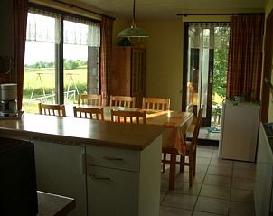 Dining room overlooking the countryside at Zur Krombisch, Elsenborn, perfect for family dinners in the Ardennes.