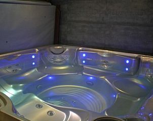 Bubble bath with mood lighting in Herresbach vacation home, Ardennes, Belgium.