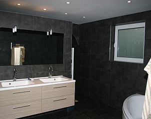 Stylish bathroom with double sink in Herresbach vacation home, Ardennes, Belgium.