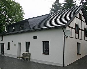 Exterior of vacation home Herresbach in Ardennes, Belgium, with traditional architecture.