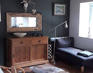 Cozy indoor space in Holiday Home in Ottr, Ardennes, Belgium, with rustic decor and lots of natural light.