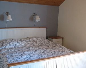 Bedroom in Holiday Home in Ottr, located in Ardennes, Lige, Belgium. Comfortable accommodation with rustic charm and cozy decor.