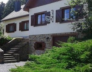 Front of Au Vieux Sapin vacation home in Felenne, Ardennes, Belgium with stone details.