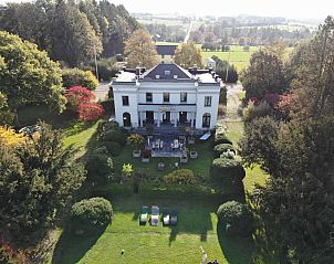 Vacation house for 8 persons in Couvin, Ardennes offers a beautiful view of the green surroundings and spacious garden for relaxation.