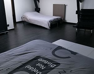 Spacious bedroom in Holiday home for 8 persons in Couvin, Ardennes, Belgium. Comfortable beds in a modern vacation home.