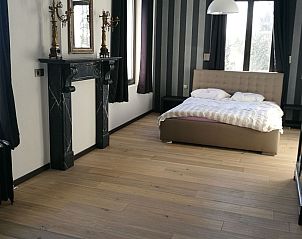 Stylish bedroom in Holiday home for 8 persons, Couvin, Ardennes. Enjoy luxury and comfort in this Belgian vacation home.