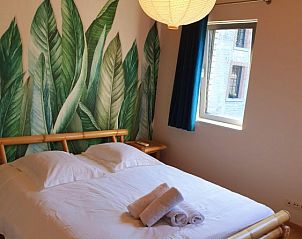 Attractive bedroom with plant motif in Gite Entre Roches et Nature, vacation home in Dinant, Ardennes, Belgium.