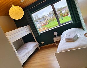Children's room with bunk beds in Gite Entre Roches et Nature, vacation home in Dinant, Ardennes, Belgium overlooking the village.
