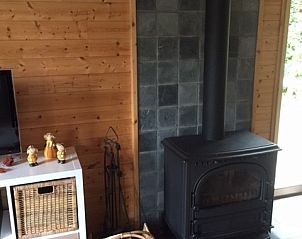 Wood stove in Chalet Eikenblad, cozy vacation home in Durbuy, Ardennes, Belgium.