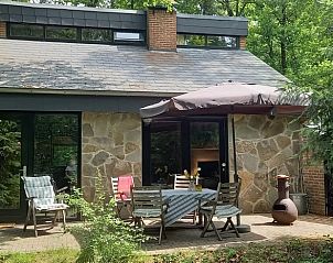 Enjoy the peace on the terrace of Cottage in Durbuy, Izier, cottage in the Ardennes, Luxembourg, Belgium, surrounded by green nature.