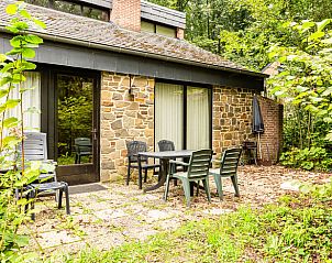 Rustic terrace at Cottage in Izier, cottage in Ardennes, Luxembourg, Belgium, surrounded by nature and greenery.