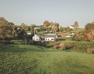 View of the green hills surrounding Casa Nouche vacation home in Engreux, Ardennes, Belgium.