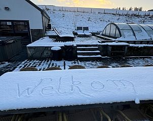 Snow covers the terrace of a cottage in Houffalize, Ardennes, Belgium, with 