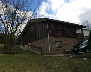 Side view of Chalet Ma Reine in the Ardennes, Remouchamps, surrounded by nature.
