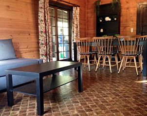 Living room of Chalet Ma Reine in Remouchamps, Ardennes, with comfortable seating area.
