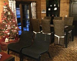 Cozy dining room in Chalet Ma Reine, Remouchamps, Ardennes, with Christmas tree.