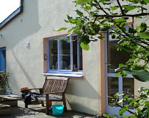 Charming terrace at La Terra vacation home, Durbuy, surrounded by greenery.