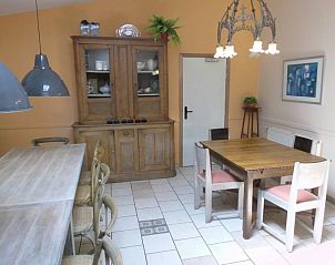 Dining room with antique cabinet in La Terra vacation home, Durbuy, Ardennes.