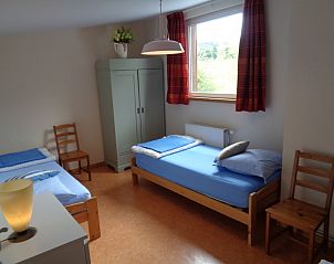 Bright bedroom in La Terra vacation home Durbuy, overlooking nature.