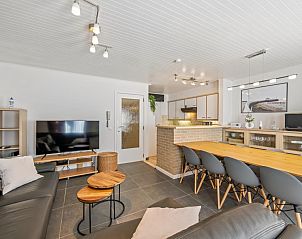 Cozy living room in vacation home Nieuwstraat 10 - V2, Blankenberge, Belgian coast. Modern interior with open kitchen and comfortable seating area.