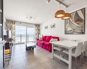 Bright living room of vacation home Ter Duinen - 0601 in Blankenberge, Belgian coast, with sea view and modern decor.