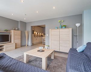 Cozy living room of vacation home Prinsenlaan - VER1 in Blankenberge, Belgian coast, with modern furnishings and comfortable seating area.