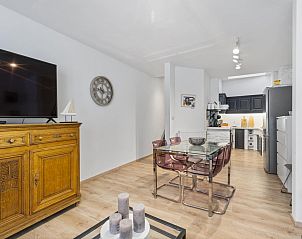 Stylish living room of vacation home Badersstraat 3 in Blankenberge, Belgian coast, with modern kitchen and cozy dining area.