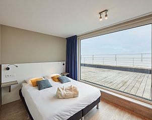 Luxe slaapkamer in Unieke penthouse met panoramisch zeezicht |10p, Blankenberge, Belgische kust. Ontspan met uitzicht op zee.
