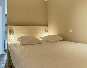 Gezellige slaapkamer in de Familiesuite met stadszicht, Blankenberge, Belgische kust. Perfect vakantieverblijf voor 2 volwassenen en 2 kinderen.