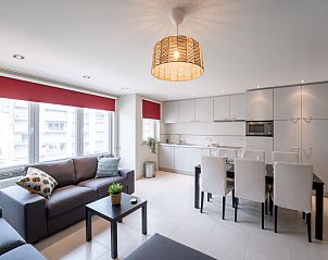 Spacious living room and kitchen in Apartment Andrei with parking in Blankenberge, Belgian coast, perfect for a relaxing vacation.