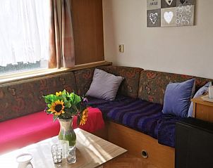 Comfortable sitting area in chalet Jabbeke no 42, De Haan, Belgian coast, with lots of daylight.