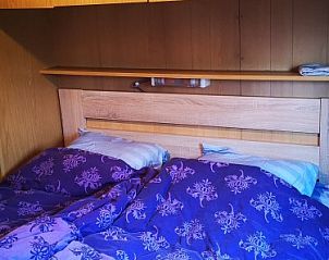 Cozy bedroom in chalet Jabbeke no 42, De Haan, Belgian coast, with cozy bedding.