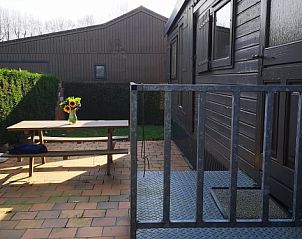 Spacious terrace at chalet Jabbeke no 42, De Haan, Belgian coast, ideal for outdoor breakfast.
