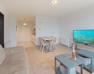 Cozy living room of Apartment Seaview 2 in Bredene, Belgian coast, with modern furnishings and comfortable seating area.