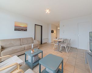 Cozy living room of Apartment Seaview 2 in Bredene, Belgian coast, with comfortable sitting area and modern dining area.