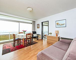 Cozy living room of Apartment Ref. 702 in Bredene, Belgian coast, with panoramic views and comfortable furniture.