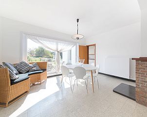 Bright dining room in Holiday home sea-kret, Bredene, Belgian coast, overlooking garden, ideal for relaxing vacation stay.