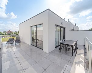 Enjoy the spacious terrace of Holiday Home Bredunepark in Bredene on the Belgian coast, perfect for relaxation and outdoor meals.