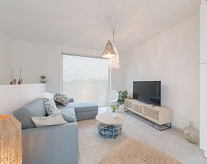 Cozy living room of Holiday home Bredunepark in Bredene, Belgian coast, with modern furnishings and comfortable seating area.