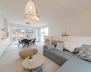Stylish living room of Holiday home Bredunepark in Bredene, Belgian coast, with modern decor and lots of natural light.